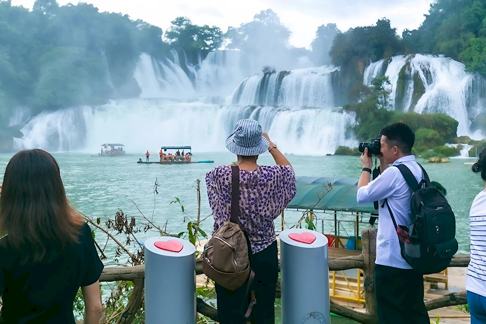 The closer you get, the more you can admire the intricate layers of water pouring down moss-covered rocks, surrounded by lush vegetation